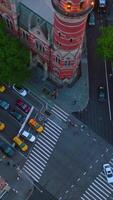 Many cars stopped at the crossroads waiting their turn to move. Busy traffic streets of New York at daytime from top view. Vertical video