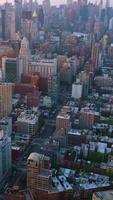 City scenery with diversity of modern architecture. Amazing New York panorama hazy at backdrop. Top view. Vertical video