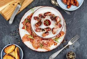 Bacon wrapped date skewers photo