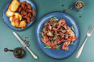 A plate of bacon wrapped dates. photo