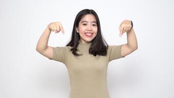 Beautiful Asian Woman Showing Product and Pointing Down Isolated On White Background video