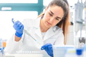 Young woman scientist in a research laboratory creating a scientific experiment, laboratory concept photo