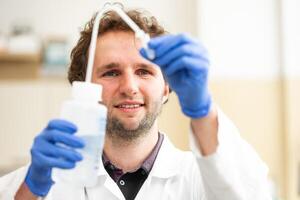 Chemistry lab concept, scientist conduct experiments in a chemist laboratory photo