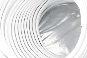 Coiled water pipes for underfloor heating ready for installing, concept of heated floor photo