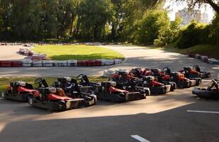 Karts Lined Up In Order At The Start Of The Go-karting Circuit photo