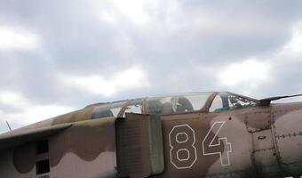 Cabin of a two-seat military bomber under gray cloudy sky stock photo
