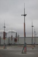 Parking Zones On A Rooftop Car Parking With Industrial Background photo