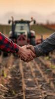 Business and farmer sealing a deal with a handshake. photo
