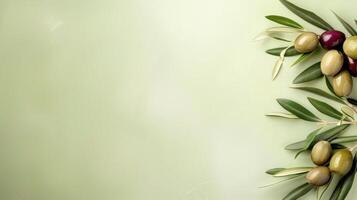 Ripe olives on branch with leaves against green background with copy space. photo