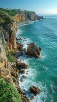 Majestic rocky cliffside overlooking crashing ocean waves. photo