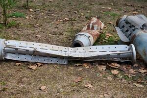 The tail section of a 220 mm rocket for the Uragan rocket fire system on a city flowerbed in Mykolaiv photo