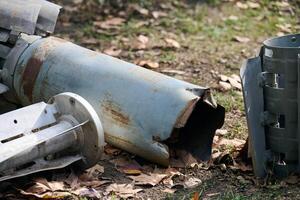 The tail section of a 220 mm rocket for the Uragan rocket fire system on a city flowerbed in Mykolaiv photo