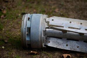 The tail section of a 220 mm rocket for the Uragan rocket fire system on a city flowerbed in Mykolaiv photo