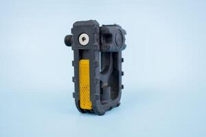 folding bicycle pedals, part of a folding bicycle, isolated on blue background photo