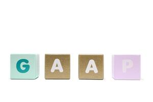 text GAAP Generally Accepted Accounting Principles on colorful wooden isolated on a white background photo