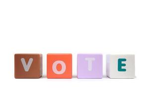 text VOTE on colorful wooden isolated on a white background photo
