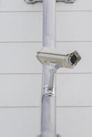 CCTV cameras on metal poles so as not to damage building walls to monitor, observe and record incident evidence for crime investigation and prevention. photo