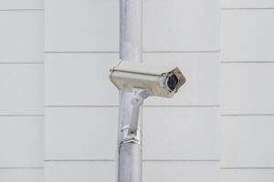 CCTV cameras on metal poles so as not to damage building walls to monitor, observe and record incident evidence for crime investigation and prevention. photo