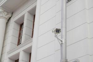 CCTV cameras on metal poles so as not to damage building walls to monitor, observe and record incident evidence for crime investigation and prevention. photo