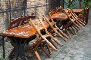 simple minimalist wooden tables and chairs for sitting and drinking coffee in a coffee shop with a natural atmosphere photo