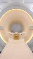 A medical CT or MRI machine is located in a diagnostic clinic, showcasing advanced imaging technology. This essential equipment is vital for accurate diagnoses and ensures high-quality patient care video