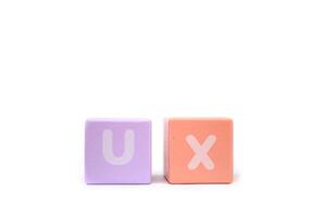 text UX User Experience on colorful wooden isolated on a white background photo