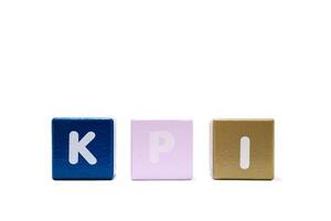 text KPI Key Performance Indicator on colorful wooden isolated on a white photo