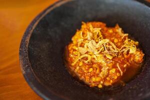 Onion Sambal or Spicy Onion Sauce with ingredients, Shallots, Red Chilies, garlic and salt photo