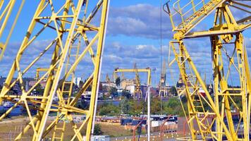Szczecin, Poland. 14 September 2024. Landscape view and ships on the Odra river and old cranes photo