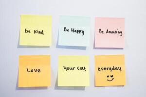 Be kind, be happy,be amazing on sticky notes. Motivational for personal development, inspirational handwriting. Isolated background photo
