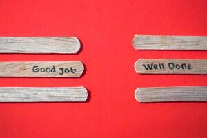 stick of ice cream with the words Good Job and Well Done. Motivational quotes, optimism, positive words. Isolated on background photo