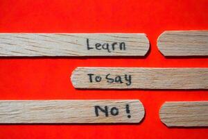 stick of ice cream with the words Learn to say No. Motivational quotes, optimism, positive words. Isolated on background photo