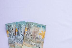 Indonesian money 2000 rupiah in close up photo from top corner