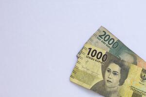 Indonesian money 2000 rupiah in close up photo from top corner