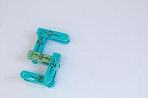clothespin letter s photographed close up from a side angle with isolated background photo