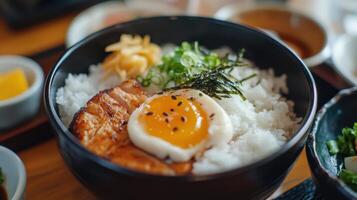 A bowl of rice with an egg on top photo