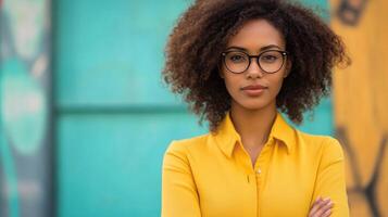 A beautiful young woman with glasses and a yellow shirt photo