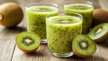 Kiwi juice with kiwi fruit on wooden table photo