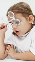 Diagnosis and improvement of vision in modern ophthalmology in young patients. The girl playfully engages in prevention, emphasizing the importance of a comfortable approach to treatment. video