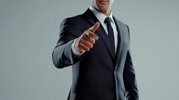 Confident Businessman in Suit Pointing Forward on Isolated Background for Professional and Corporate Themes photo