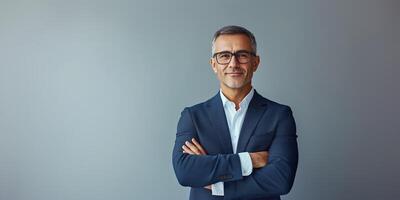 Confident Businessman in Formal Suit with Arms Crossed on Isolated Background photo