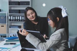 Team of business people are meeting to analyze data for marketing plan,Market research reports and income statistics, Financial and Accounting concept. photo