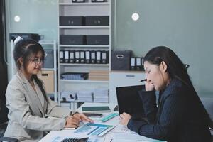 Team of business people are meeting to analyze data for marketing plan,Market research reports and income statistics, Financial and Accounting concept. photo