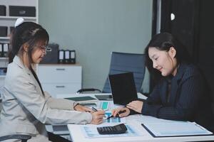 Team of business people are meeting to analyze data for marketing plan,Market research reports and income statistics, Financial and Accounting concept. photo