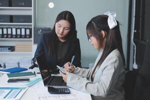 Team of business people are meeting to analyze data for marketing plan,Market research reports and income statistics, Financial and Accounting concept. photo