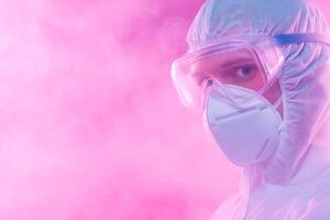 Researcher in protective gear examines viral samples surrounded by colorful smoke and dynamic lighting effects photo