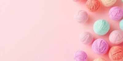 Abstract arrangement of pastel yarn balls in a geometric pattern on a minimal background photo