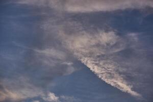 White clouds on blue sky background in the sunny afternoon photo