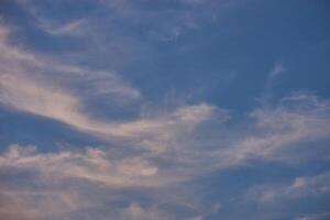 White clouds on blue sky background in the sunny afternoon photo