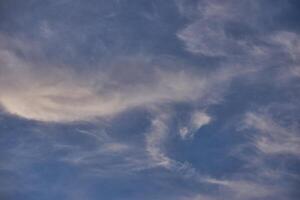 White clouds on blue sky background in the sunny afternoon photo